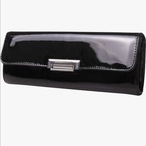 NWOT BCBGeneration Black Clutch with Glossy Finish and Metallic Detail